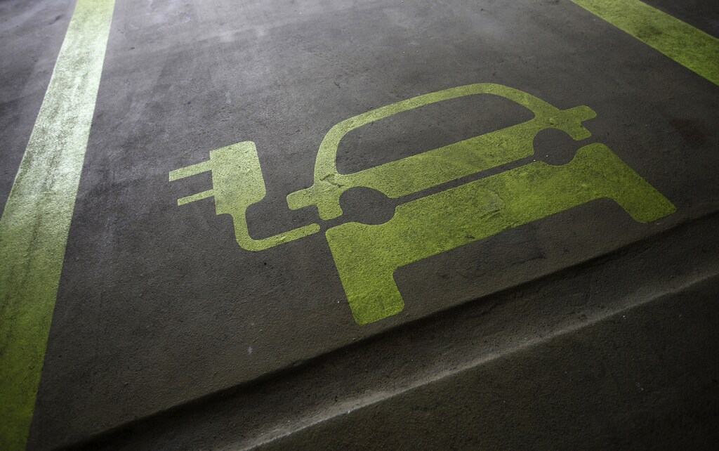 THIS PICTURE IS 6 OF 25 TO ACCOMPANY INSIGHT "ELECTRIC-CAR/BIG OIL". SEARCH IN YOUR PICTURE SYSTEM FOR KEYWORD "ELECTRIC VEHICLES" TO SEE ALL IMAGES. (PXP310-334)A sign is painted on a parking space for electric cars inside a car park in Hong Kong January 29, 2012. Many of the headlines out of autoshows in the past couple of years have been captured by the launch of electric cars such as Nissan's Leaf, the Tesla sports car, plug-ins like General Motors' Chevrolet Volt, and the latest incarnation of the Toyota Prius. Other manufacturers including BMW, Rolls Royce and Porsche have presented electric-powered prototypes. On the basis of this, one could be forgiven for thinking the auto industry is betting big on electric power. Yet few auto executives share the optimism of Renault and Nissan chief executive Carlos Ghosn who has repeatedly said he sees electric vehicles making up 10 percent of all sales in 2020. A survey of 200 auto industry executives conducted by KPMG released on Monday gave an average forecast for electric vehicles to account for 6-10 percent of global auto sales in 2025, more bullish than oil companies BP and Exxon who expect electric cars to make up no more than 4-5 percent of all cars globally in 20-30 years. Picture taken January 29, 2012. To match Insight ELECTRIC-CAR/BIG OIL REUTERS/Tyrone Siu (CHINA - Tags: BUSINESS ENERGY ENVIRONMENT SCIENCE TECHNOLOGY) - GM1E8211OVW01