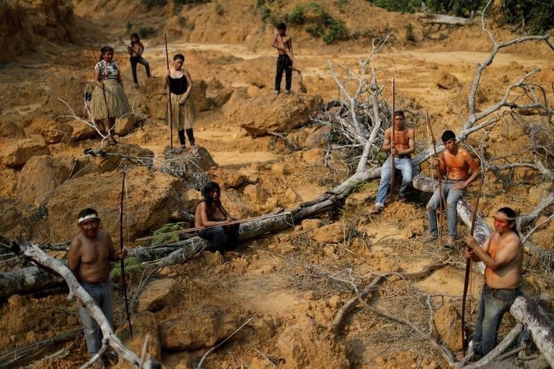 Indigenous people from the Mura tribe show a deforested area in unmarked indigenous lands inside the Amazon rainforest near Humaita, Amazonas State, Brazil August 20, 2019. Picture taken August 20, 2019. REUTERS/Ueslei Marcelino - RC116FD51B00