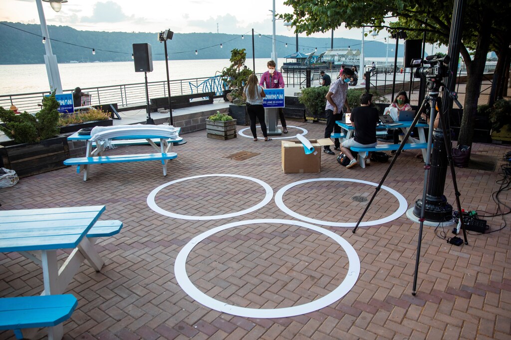 Social distancing circles are seen as campaign staff prepare for Jamaal Bowman to arrive at a watch party for the democratic primary for New York's 16th Congressional District in Yonkers, New York, amid the global outbreak of the coronavirus disease (COVID-19), U.S., June 23, 2020. REUTERS/Lucas Jackson - RC2FFH9JOHMS