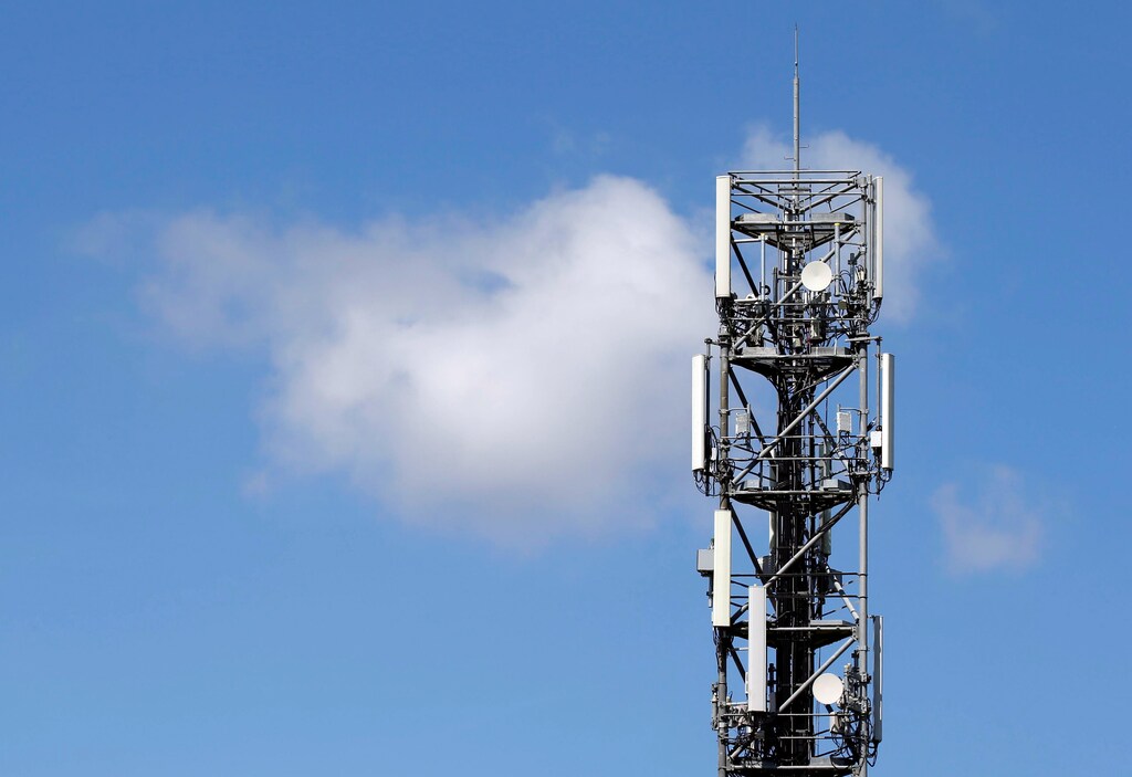 Mobile telecom transmitter relays and antenna are seen on the roof of a building in Bordeaux, France, June 19, 2018. REUTERS/Regis Duvignau - RC14C292D8A0
