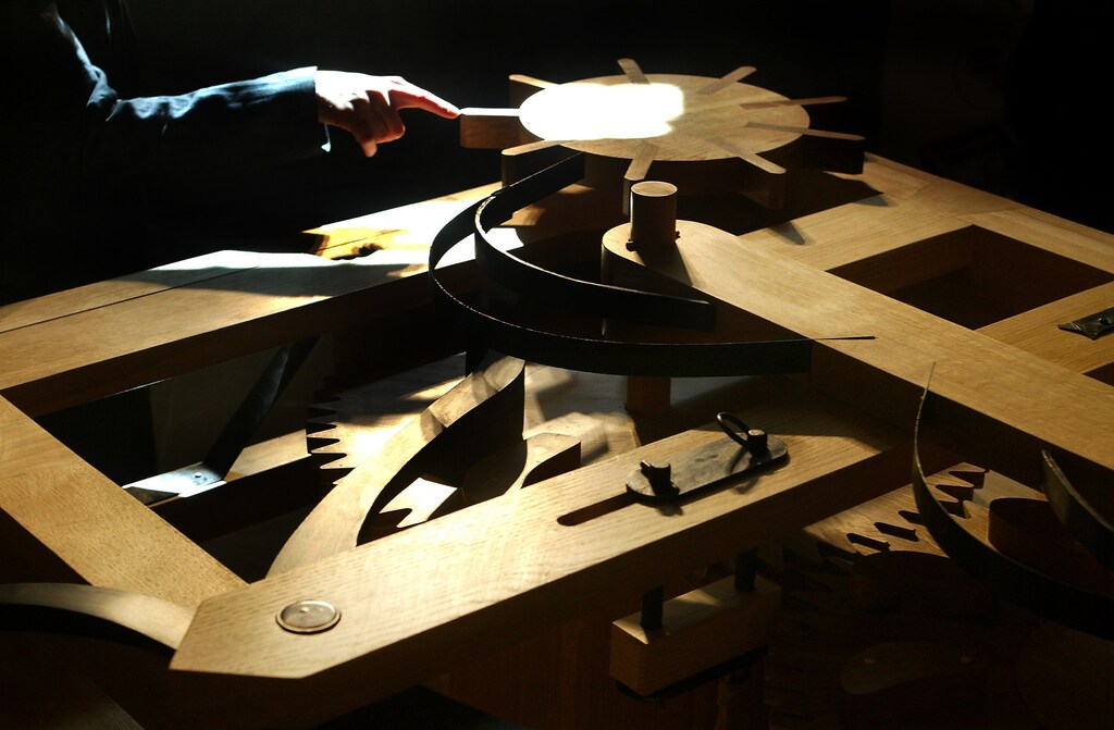 A visitor touches the model of Leonardo Da Vinci's car at the Museum of History and Science in Florence, April 23, 2004. Scientists have unveiled the first automobile built based on sketches by Leonardo Da Vinci and experts say it is the worlds first self-propelled vehicle.