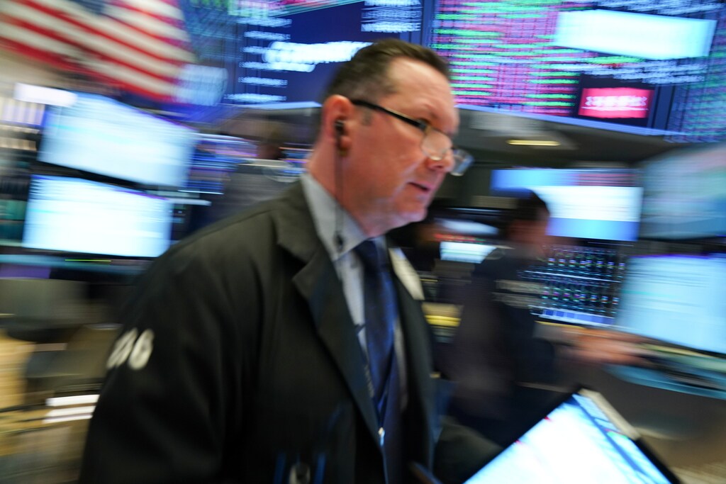 A trader works at the New York Stock Exchange (NYSE) in New York, U.S women business businesswoman businessman corporation corporate finance wall street stock exchange capitalism private ownership board c-suite ceos cfos corporation united states us america wall street change gender parity equality goldman sachs davos industry representation fair finance fiscal financial economics economies trading trade price money profit value men male female change changing 2020 future taxation tax wealth gross domestic product gdp environment renewable solar energy change transition friendly environment carbon footprint carbon emissions reduction change natural climate change global warming air pollution clean energy power renewables plastic plastics Weather extreme storm hurricane typhoon flooding flood floods danger rain wind windy rainy flash floods
