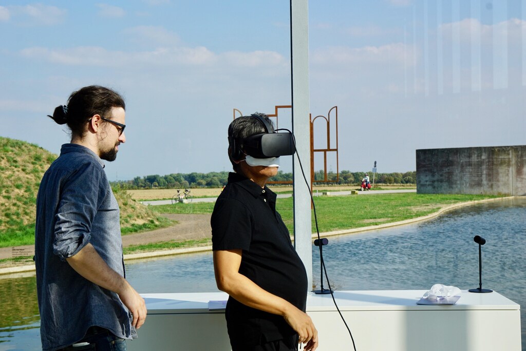 Image shows a person wearing a VR headset, which is one of the five key technologies that will transform our lives