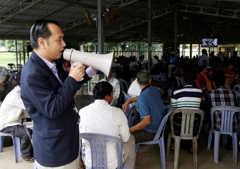 Neth Pheaktra, Press Officer at the Extraordinary Chambers in the Courts of Cambodia (ECCC) speaks as people attend the closing statement in case 002/02 against former Khmer Rouge leaders Nuon Chea and Khieu Samphan, on the outskirts of Phnom Penh, Cambodia, June 23, 2017. REUTERS/Samrang Pring - RTS18AIJ