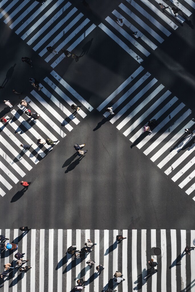 Aerial view of people crossing the road