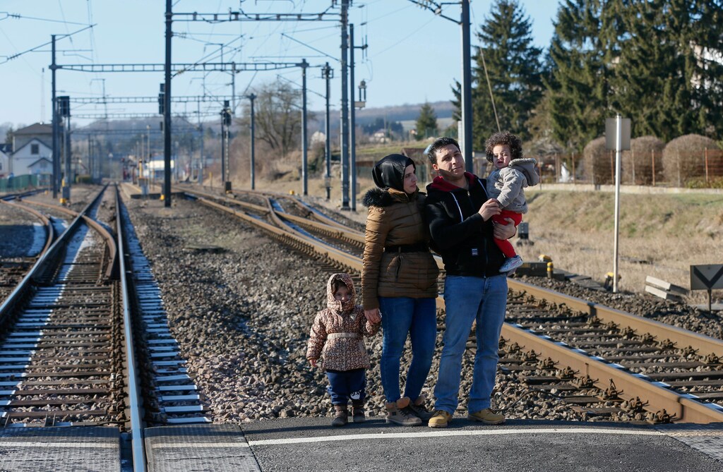 From L-R, Syrian family Shadin, Ghufran, Mohamed and Maya al-Khalaf pose for a photograph near their apartment in Wecker, Luxembourg, January 19, 2017. Picture taken January 19, 2017. To match Insight EUROPE-MIGRANTS/RAQQA REUTERS/Yves Herman - RTS13YAE