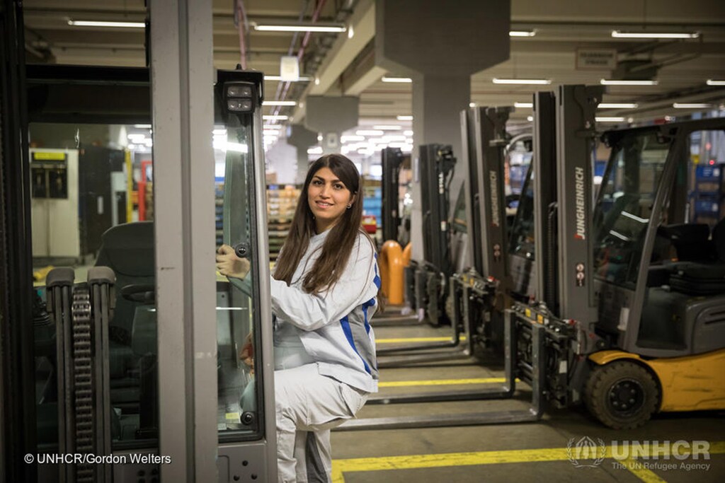 Mastura Ekhlas, a refugee from Afghanistan, at work in the VW logistics centre in Baunatal, Germany