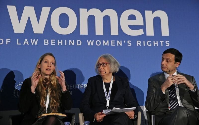 Everyday Sexism Project Founder Laura Bates (L) speaks at the Trust Women conference as Urban Planning Group's Gender Expert for the City of Vienna Eva Kail (C) and European Bank for Reconstruction and Development's (EBRD) Director of the Municipal and Environmental Infrastructure Jean-Patrick Marquet look on at the Trust Women conference in London November 18, 2014. REUTERS/Suzanne Plunkett (BRITAIN - Tags: SOCIETY POLITICS BUSINESS) - GM1EABI1PY301