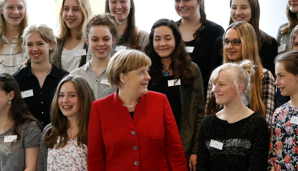 German Chancellor Angela Merkel poses with participants of a Girls Day career event at the Chancellery in Berlin April 27, 2016. Girls Day seeks to attract female pupils to careers in IT, technological and natural science sectors of the German industry. REUTERS/Fabrizio Bensch - LR1EC4R0WO0RP
