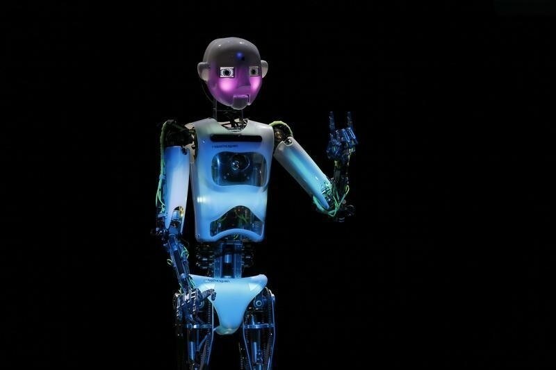 Humanoid robot of British company RoboThespian "blushes" during the opening ceremony of the Hanover technology fair Cebit March 9, 2014, where Britain is this year's partner country. REUTERS/Wolfgang Rattay (GERMANY - Tags: BUSINESS SCIENCE TECHNOLOGY TELECOMS) - RTR3GC9I