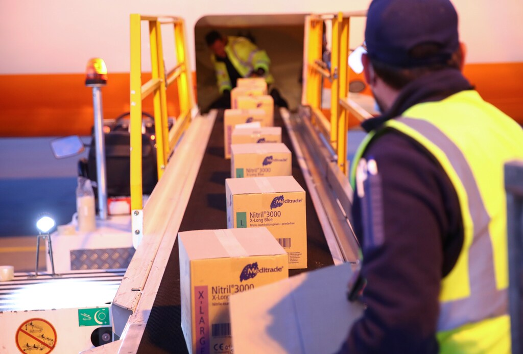 Staff load cargo sent by the International Committee of Red Cross (ICRC) to Ukraine into a cargo plane, during the coronavirus disease (COVID-19) outbreak, at Cointrin Airport in Geneva, Switzerland, April 1, 2020. REUTERS/Denis Balibouse - Coronavirus china virus health healthcare who world health organization disease deaths pandemic epidemic worries concerns Health virus contagious contagion viruses diseases disease lab laboratory doctor health dr nurse medical medicine drugs vaccines vaccinations inoculations technology testing test medicinal biotechnology biotech biology chemistry physics microscope research influenza flu cold common cold bug risk symptomes respiratory china iran italy europe asia america south america north washing hands wash hands coughs sneezes spread spreading precaution precautions health warning covid 19 cov SARS 2019ncov wuhan sarscow wuhanpneumonia pneumonia outbreak patients unhealthy fatality mortality elderly old elder age serious death deathly deadly women business businesswoman businessman corporation corporate finance wall street stock exchange capitalism private ownership board c-suite CEOs CFOs corporation united states us america wall street change gender parity equality goldman sachs davos industry representation fair finance fiscal financial economics economies trading trade price money profit value men male female change changing 2020 future taxation tax wealth gross domestic product gdp