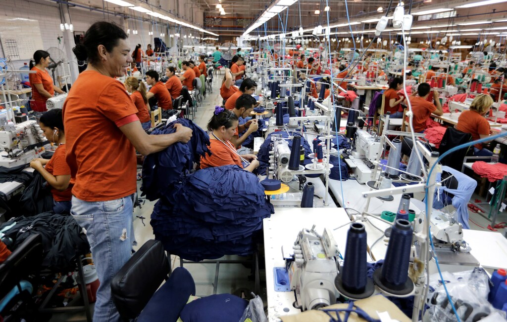 Paraguayan workers assemble clothes for Brazilian retailer Riachuelo at the factory of Texcin in Limpio, Paraguay December 20, 2016.