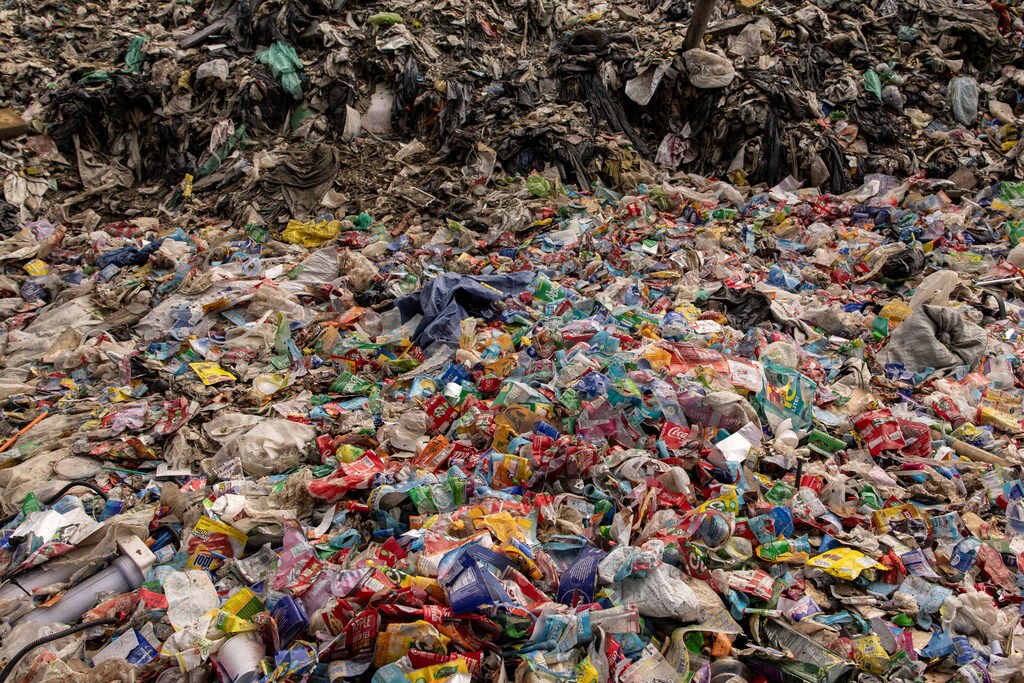 Plastic wrappers of commercial products are pictured at a garbage dump in Rodriguez, Rizal province, Philippines, November 28, 2024: Plastic pollution is a major and growing climate threat