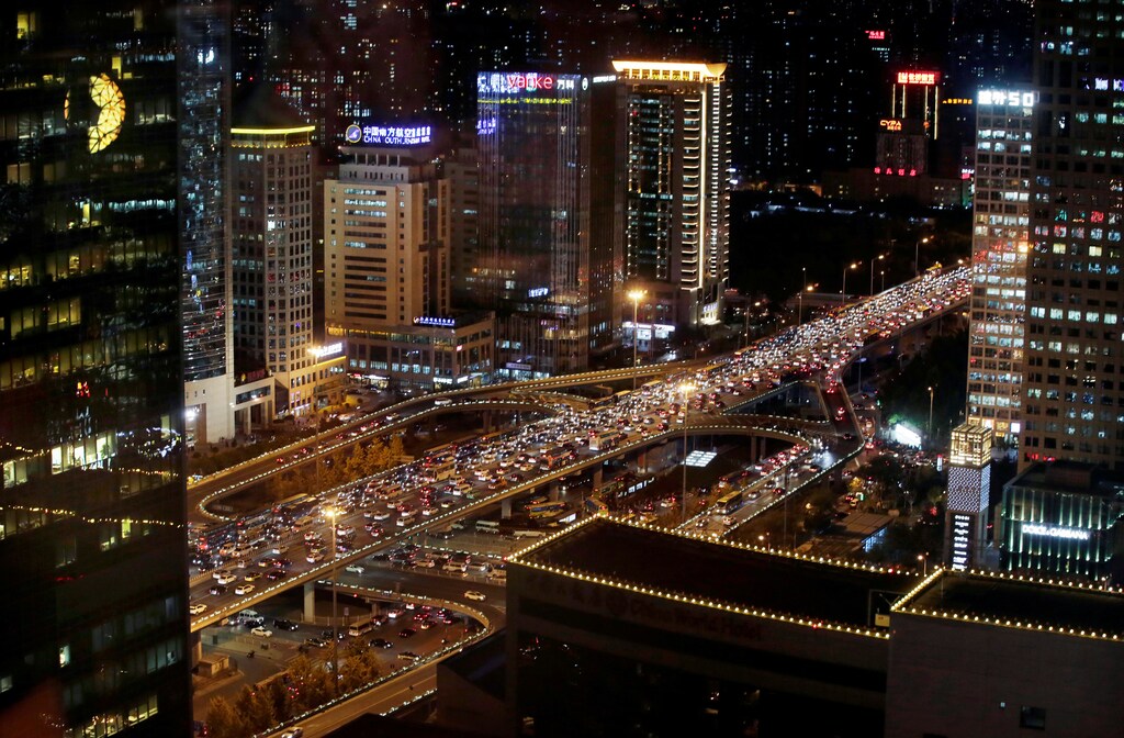 Vehicles are seen through a window as they drive on Guomao Bridge during rush hour in Beijing, China, November 7, 2016. REUTERS/Jason Lee - RTX2SAP0