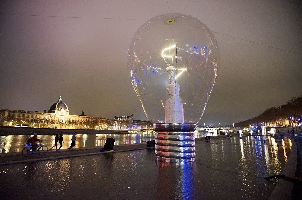 View of a giant incandescent light bulb as part of the Incandescence installation by artist Severine Fontaine during the rehearsal for the Festival of Lights in central Lyon late in the night December 4, 2014. The Festival of Lights (Fetes des Lumieres), with designers from all over the world, is one of Lyon's most famous Festivals to date and will run from December 5 to December 8, 2014. Picture taken December 4, 2014.
