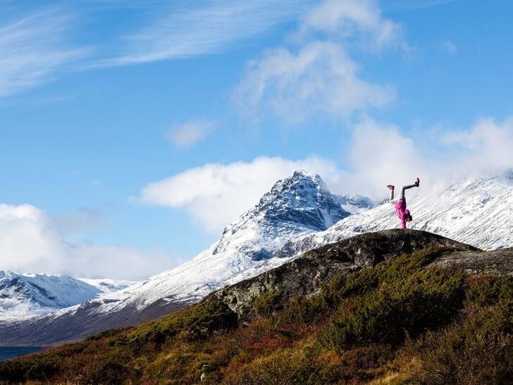 A girl stands on her hands near Vang, Norway October 01, 2016. Picture taken October 01, 2016. Svein Nordrum/NTB Scanpix/via REUTERS ATTENTION EDITORS - THIS IMAGE WAS PROVIDED BY A THIRD PARTY. FOR EDITORIAL USE ONLY. NORWAY OUT. NO COMMERCIAL OR EDITORIAL SALES IN NORWAY.