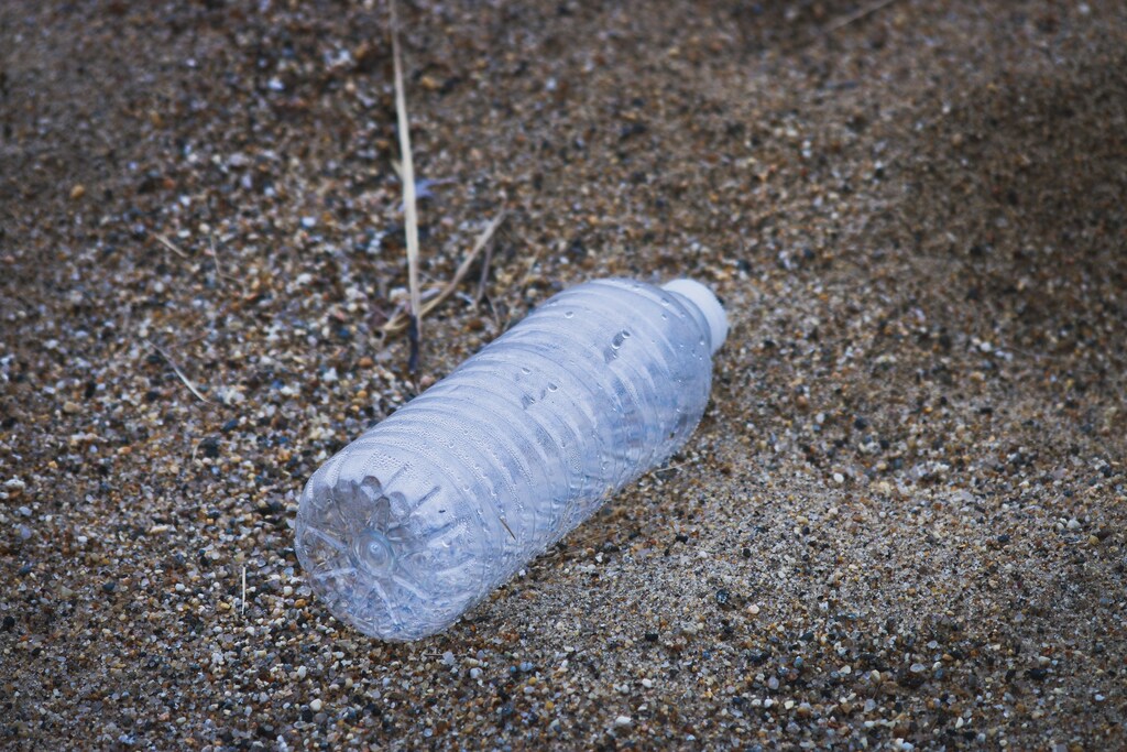 plastic pollution is a huge global problem, exemplified through this discarded plastic bottle. New Zealand are introducing methods to minimize waste