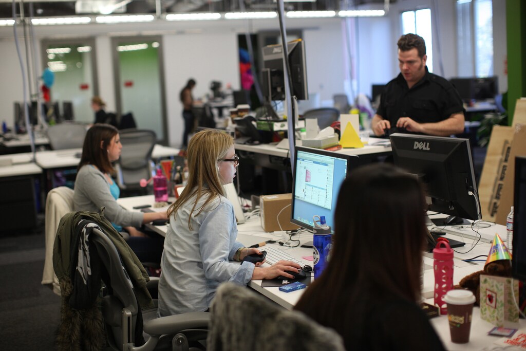 Facebook employees work in the design studio at the company's headquarters in Menlo Park, California March 2, 2012. Famous for a culture that glorifies the "hacker way," Facebook now talks of integrating "design thinking" into its products and has steadily beefed up its design studio. Design chief Kate Aronowitz dispatches designers who are paired with an engineer, a product manager and sometimes a researcher to conceive new products or improve features such as user profiles or messages. Picture taken March 2, 2012. To match Feature DESIGNERS-STARTUP/ REUTERS/Robert Galbraith (UNITED STATES - Tags: SCIENCE TECHNOLOGY BUSINESS) - RTR30OBP