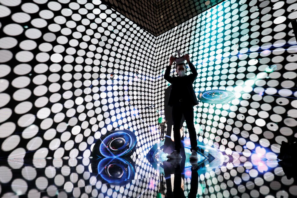 A visitor tries a metaverse service at a technology conference in Barcelona, Spain. Chief Trust Officers must excel in both risk & compliance, and brand & communications.