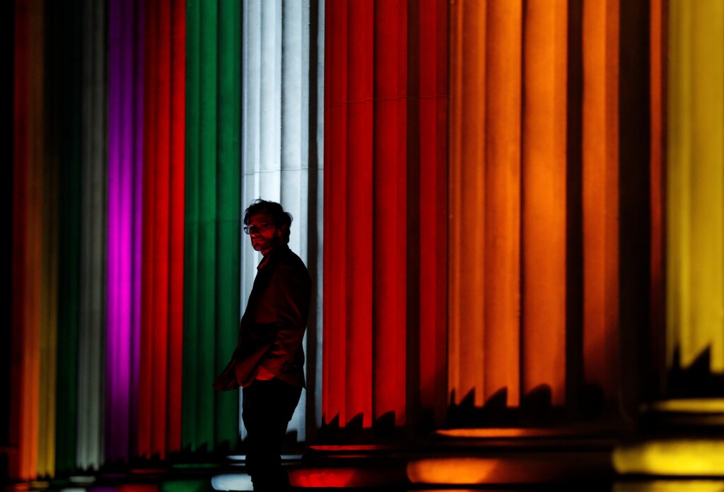 St Georges Hall is illuminated with a rainbow flag following a vigil in memory of the victims of the gay nightclub mass shooting in Orlando, in Liverpool, northern England , June 13, 2016.