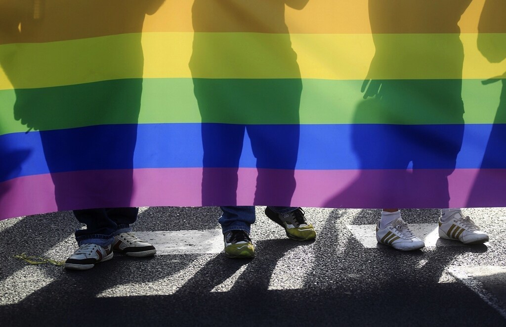People take part in a Gay Pride parade in downtown Seville June 25, 2011. REUTERS/Javier Diaz (SPAIN - Tags: SOCIETY) - RTR2O3QJ
