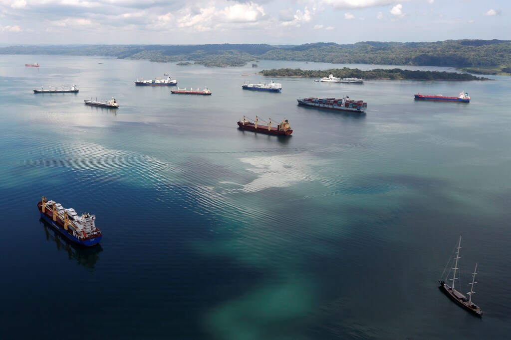 Cargo ships navigate the Panama Canal during an organized media tour by Italy's Salini Impregilo, one of the main sub contractors of the Panama Canal Expansion project, on the outskirts of Colon city, Panama May 11, 2016. REUTERS/Carlos Jasso - S1BETDNJVXAA