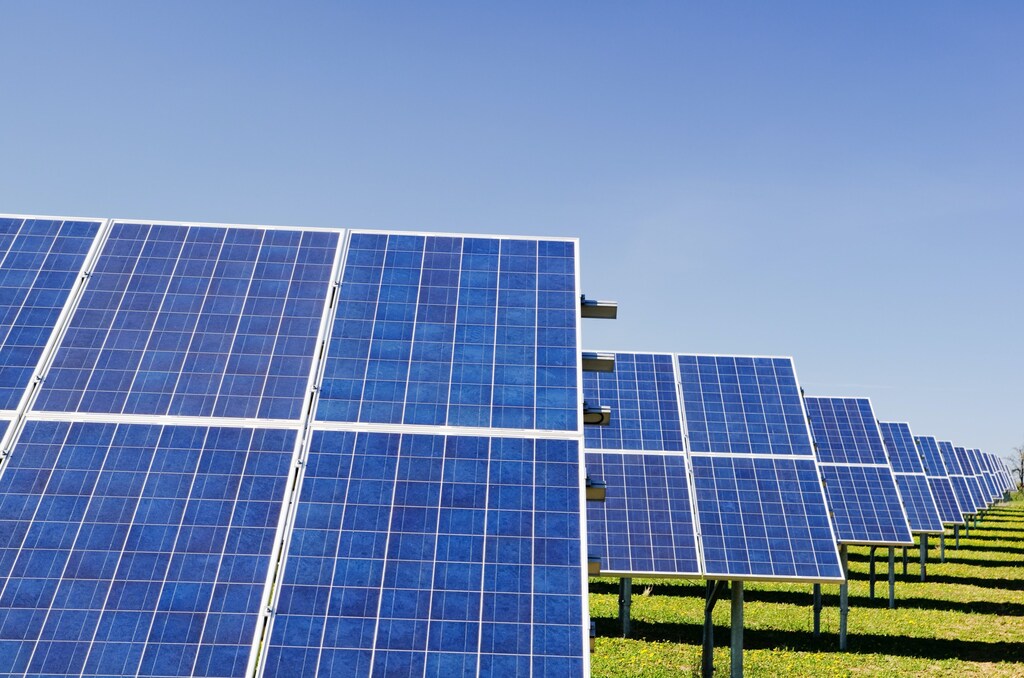 A field of solar panels, illustrating the green energy transition