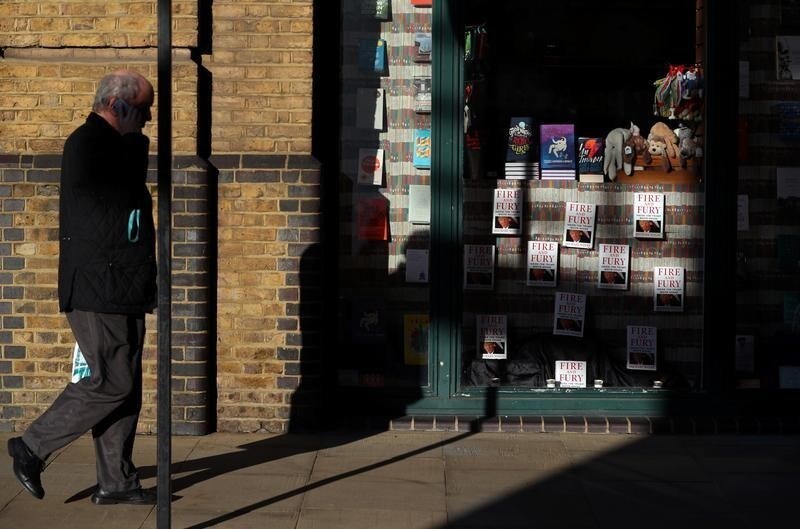 A man walks past a bookshop with Michael Wolff's book 'Fire And Fury' displayed in the window in London, Britain, January 19, 2018.