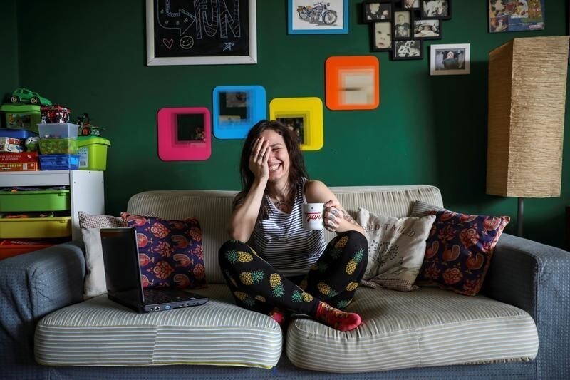 Ivana, 32, a community manager, smiles in her home where she works in Belgrade, Serbia, February 21, 2017. "Mainly you can see these (gender) gaps in state companies, which are relics of socialism. It is that standard belief where women are 'the best' at being secretaries," Ivana said. REUTERS/Marko Djurica SEARCH "WOMEN WORK" FOR THIS STORY. SEARCH "WIDER IMAGE" FOR ALL STORIES. - RC1EE9971A40