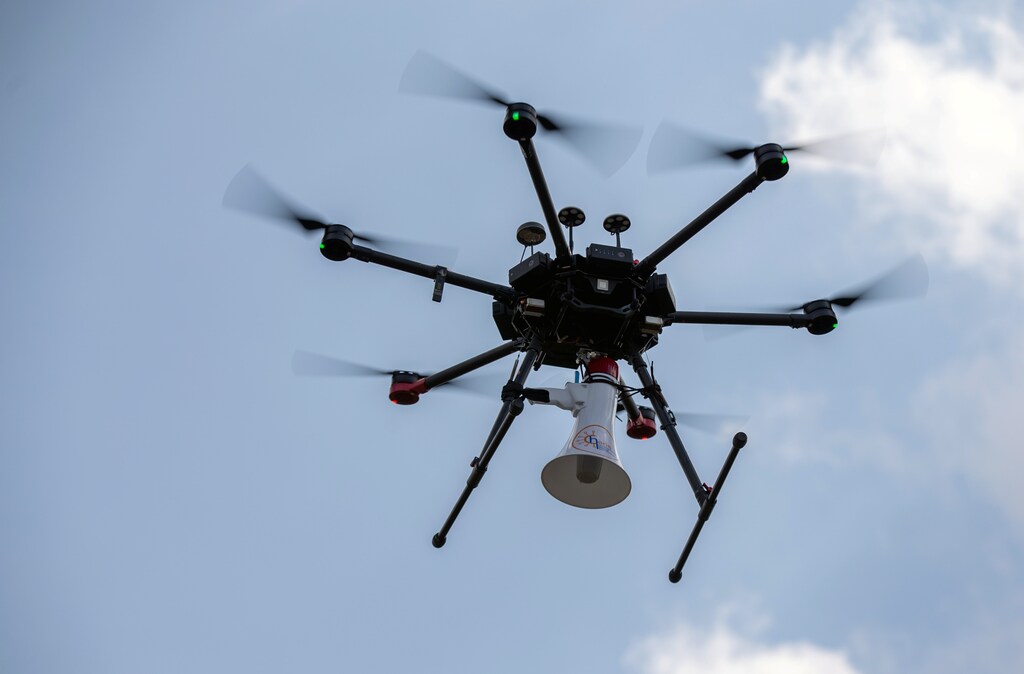 A Rwandan police drone fitted with a megaphone speaker flies in a residential neighbourhood to enforce a lockdown to stem the spread of coronavirus disease (COVID-19) in Kigali, Rwanda April 15, 2020. Picture taken April 15, 2020. REUTERS/Jean Bizimana - RC286G9T8FTO