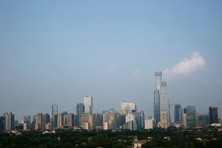 The skyscrapers of the Central Business District rise behind the capital's embassy neighbourhood in Beijing, China, July 28, 2018. REUTERS/Thomas Peter