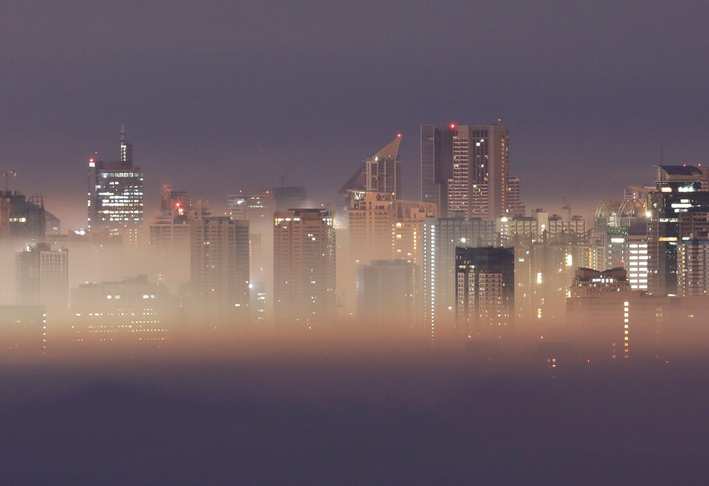 The Metro Manila skyline is seen during smog on the first break of dawn of the New Year in Antipolo City, Rizal province, Philippines, January 1, 2019