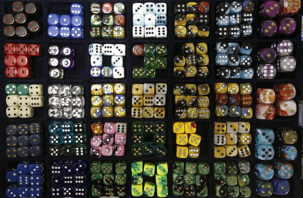 Sets of dice are seen on display during a board games festival in St. Petersburg, April 20, 2014. The festival was organised by vendors of board games to encourage young people to use and buy their products. REUTERS/Alexander Demianchuk (RUSSIA - Tags: BUSINESS SOCIETY) - GM1EA4L00ZS01