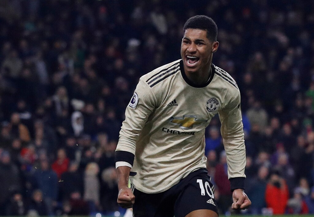 Soccer Football - Premier League - Burnley v Manchester United - Turf Moor, Burnley, Britain - December 28, 2019 Manchester United's Marcus Rashford celebrates scoring their second goal REUTERS/Phil Noble EDITORIAL USE ONLY. No use with unauthorized audio, video, data, fixture lists, club/league logos or "live" services. Online in-match use limited to 75 images, no video emulation. No use in betting, games or single club/league/player publications. Please contact your account representative for further details. - RC2L4E9RESVN
