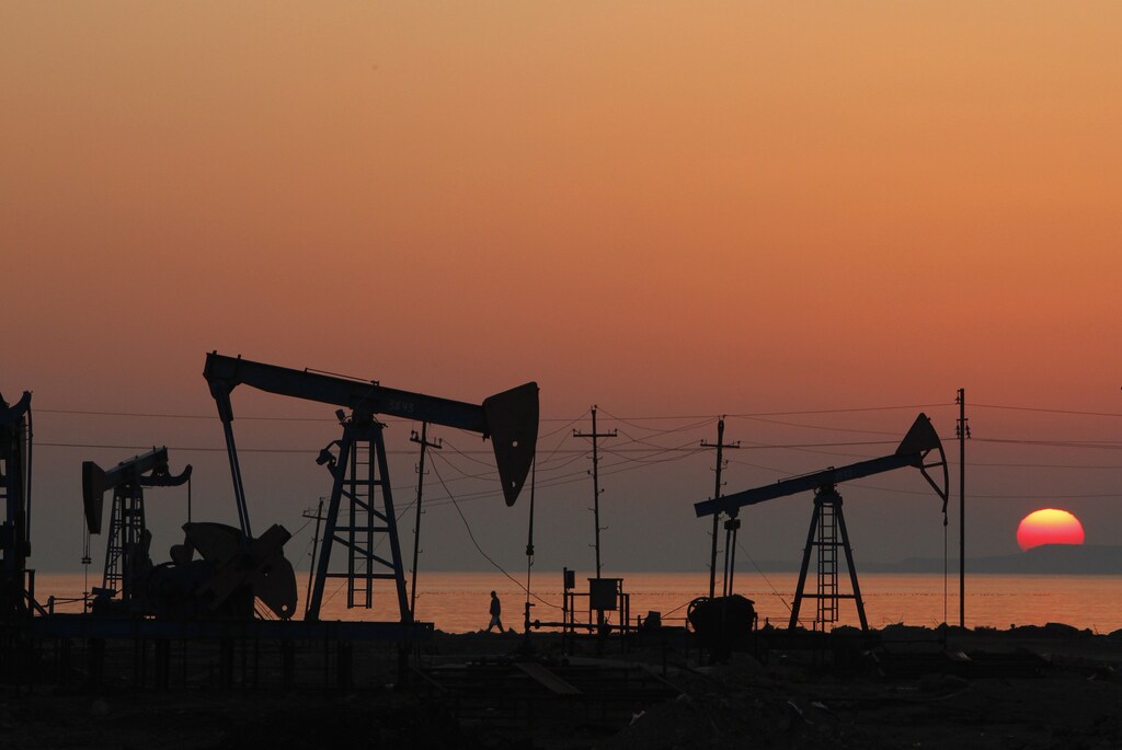 Pump jacks are silhouetted against the rising sun on an oilfield in Baku, January 24, 2013. Oil in Azerbaijan dates back to the 19th century and though the industry faltered when the country gained independence after the fall of the Soviet Union, investment has returned, new reserves tapped and oil started to flow again. Forty three million tonnes of oil was pumped in 2011 and contributed more than half of Azerbaijan's gross domestic product (GDP). Picture taken January 24, 2013