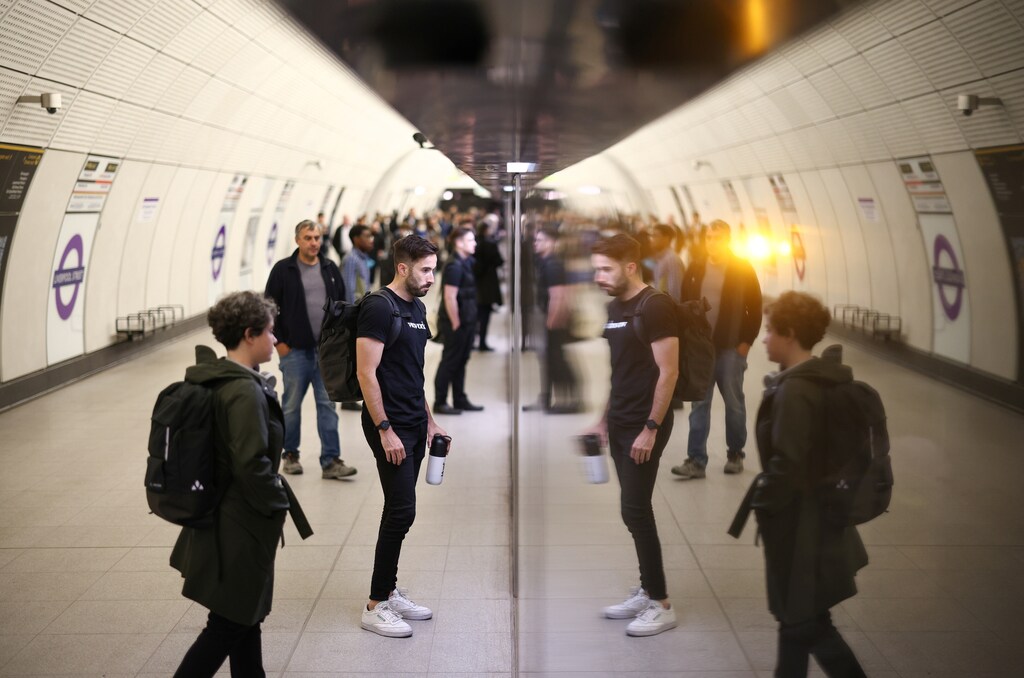 Passengers board an Elizabeth Line train at Liverpool Street underground station. London's newly-constructed Elizabeth Line, part of Transport for London's huge transit network, is an example of how through-running on regional rail can bring in new travellers.