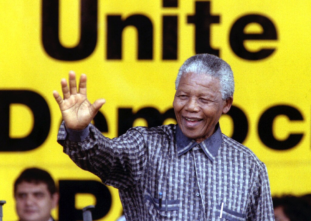 South African President Nelson Mandela greets supporters during a celebration of the 84th birthday of his ruling African National Congress (ANC) January 8.