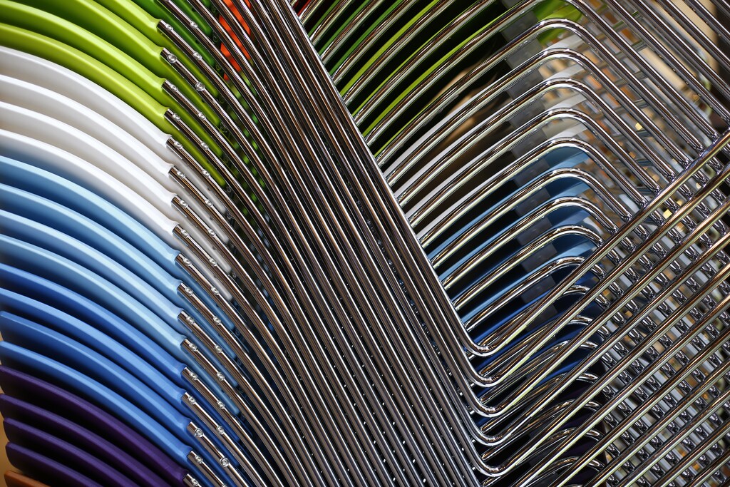 Office chairs are stacked together on a stand at the 100% Design Exhibition at Earl's Court in London September 18, 2013. REUTERS/Andrew Winning (BRITAIN - Tags: ENTERTAINMENT) - LM1E99I12TG01