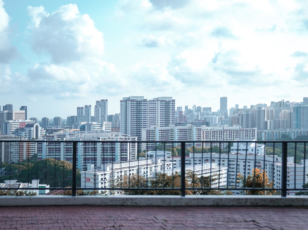 A landscape picture of balcony overlooking tall rise office blocks.