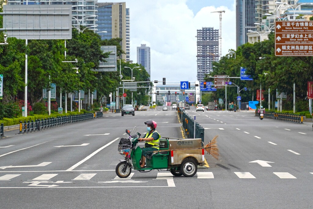 A sanitation worker drives past an intersection amid lockdown measures to curb the coronavirus disease (COVID-19) outbreak in Sanya, Hainan province, China, 6 August 2022.