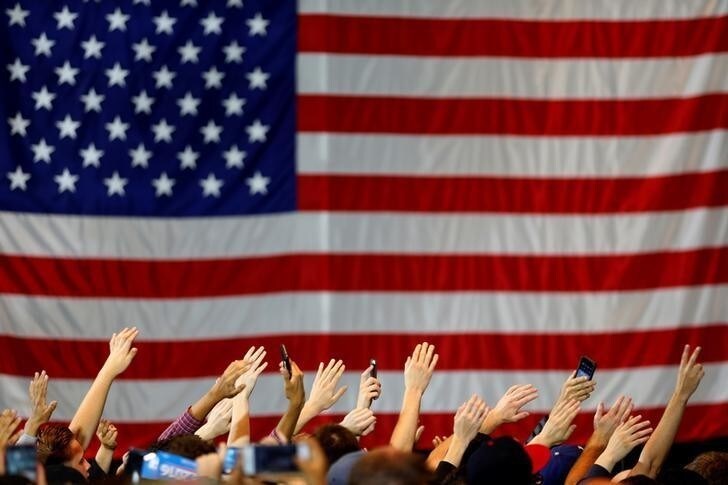 Supporters wave their hands in unison as they gather at a rally for U.S. Democratic presidential candidate Bernie Sanders in Anaheim, California, U.S., May 24, 2016. REUTERS/Mike Blake