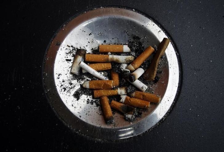 Cigarette butts are left in an ashtray at Atocha train station in Madrid January 1, 2011. A new Spanish anti-smoking law will take effect on January 2 that will prohibit smoking in all enclosed spaces as well outside hospitals, at playgrounds and schools. The Spanish Socialist government wants to put the country in line with the European Union's strictest anti-smoking nations. REUTERS/Susana Vera (SPAIN - Tags: SOCIETY POLITICS)