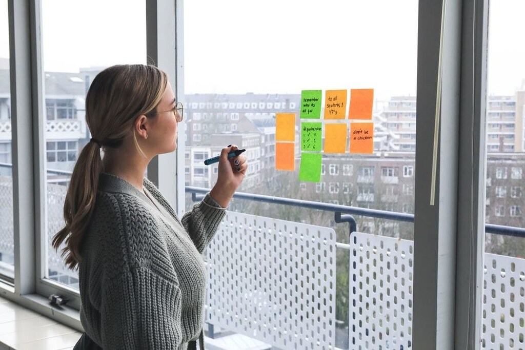 image of a woman brainstorming ideas in an office