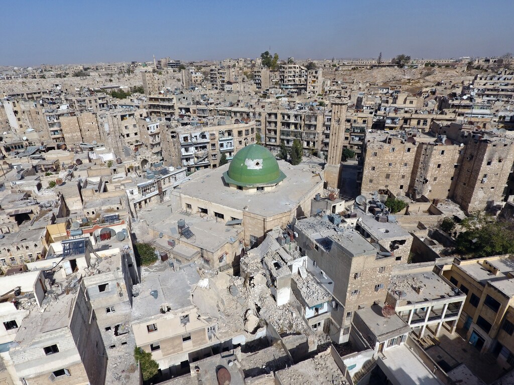 A general view taken with a drone shows damaged buildings and a mosque in the old city of Aleppo, Syria, October 13, 2016. Picture taken October 13, 2016. REUTERS/Abdalrhman Ismail - RTSS83I