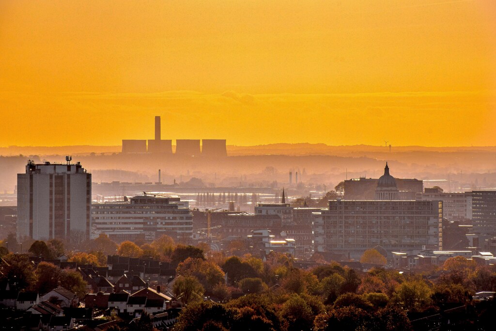 Nottingham city skyline during orange sunset.