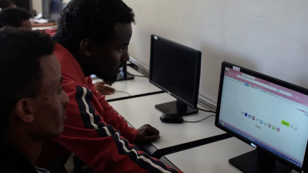 Clients at an internet café at the Jesuit Refugee Service’s community centre in Addis Ababa, Ethiopia.