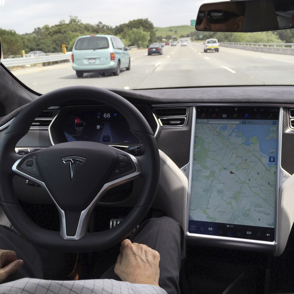 The interior of a Tesla Model S is shown in autopilot mode in San Francisco, California, U.S., April 7, 2016. REUTERS/Alexandria Sage/File Photo - RTSHH2N