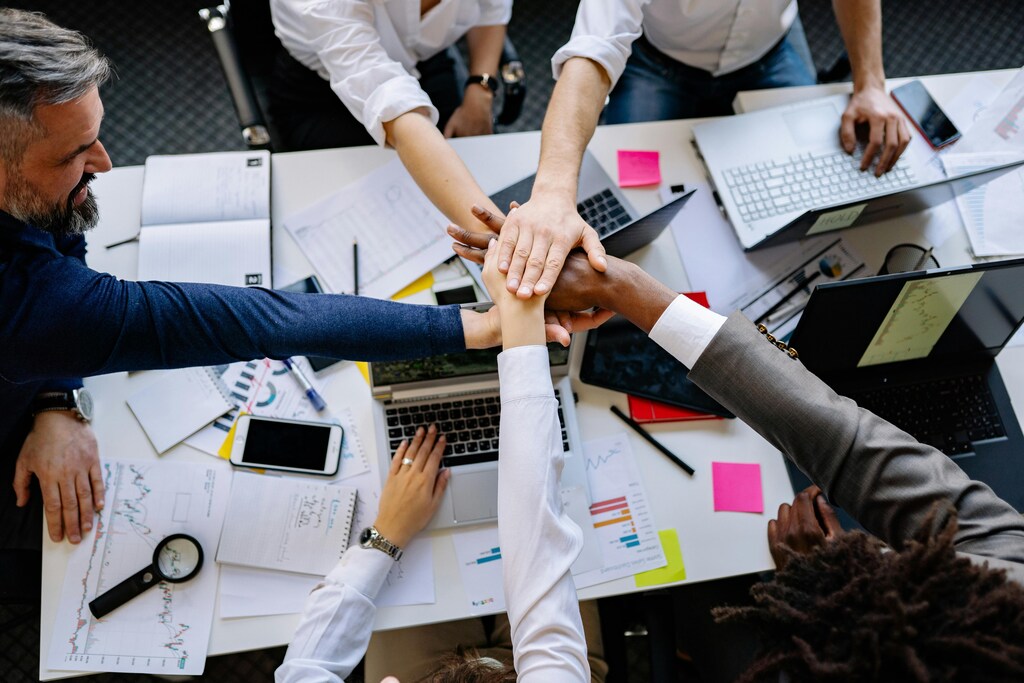 Members of a quantum startup in a meeting, collaborating on innovative technologies and strategic plans.