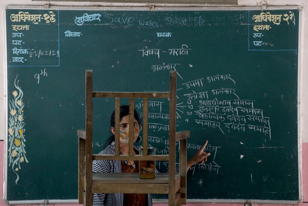 A teacher conducts an online class for her students inside a government-run school, amidst the spread of the coronavirus disease (COVID-19), in Mumbai, India, February 22, 2021. REUTERS/Niharika Kulkarni