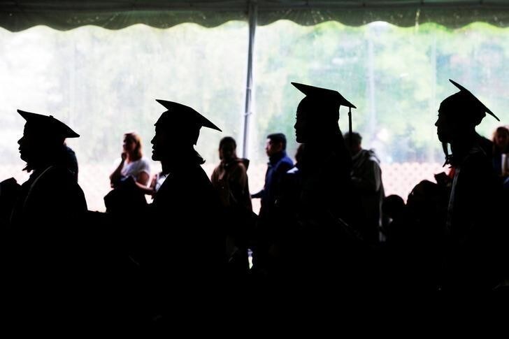 Graduating seniors line up to receive their diplomas during Commencement at Wellesley College in Wellesley, Massachusetts, U.S., May 26, 2017. REUTERS/Brian Snyder